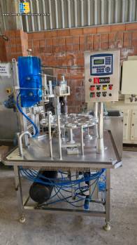 Envasadora dosadora seladora rotativa em inox com selo de alumínio para potes, copos e frascos Delgo Envasadora dosadora seladora rotativa em inox com selo de alumínio para potes, copos e frascos Delgo